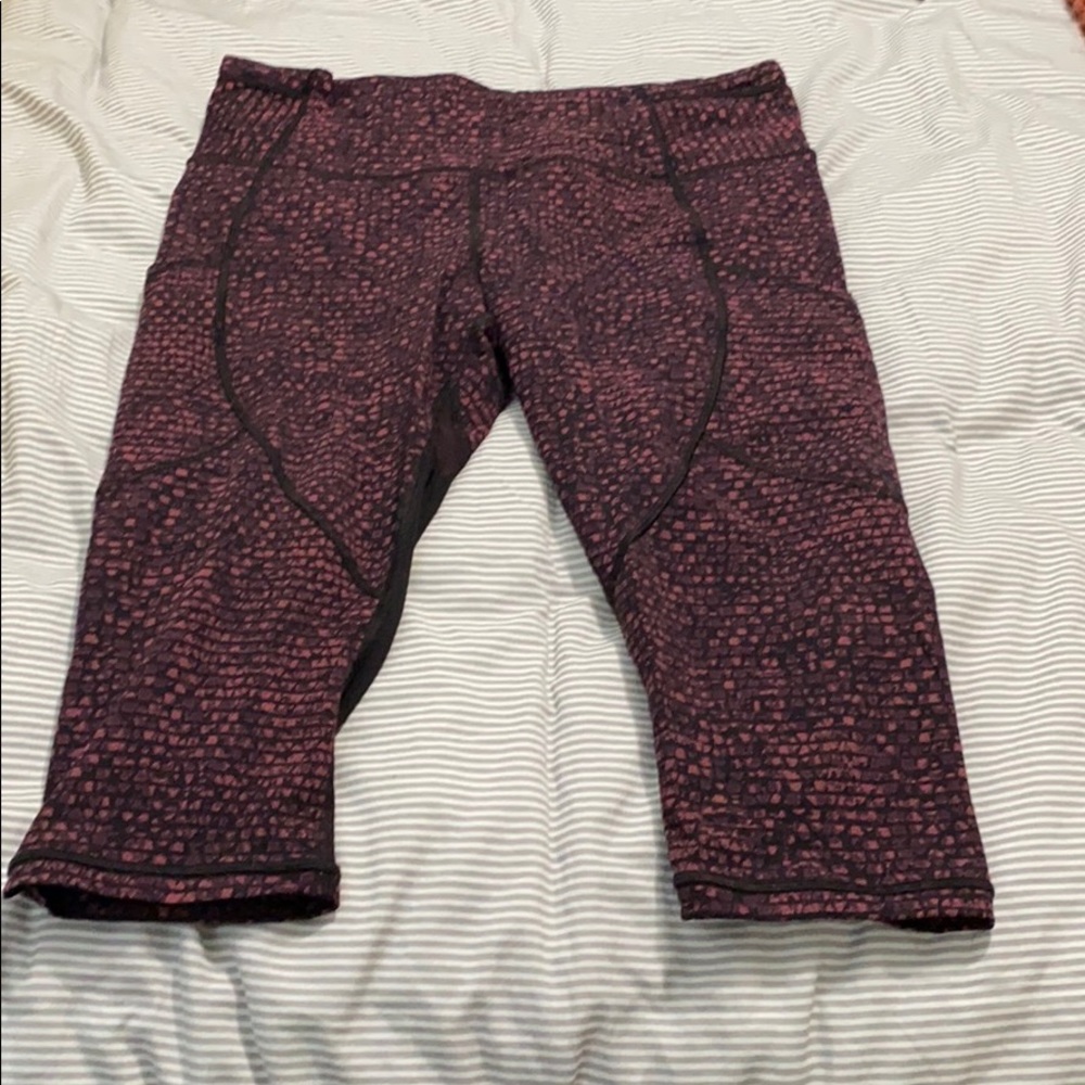 Cropped pink and black Lululemon leggings